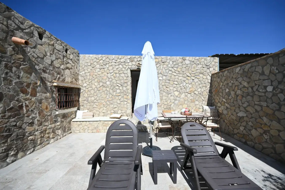 Sombrilla y tumbonas